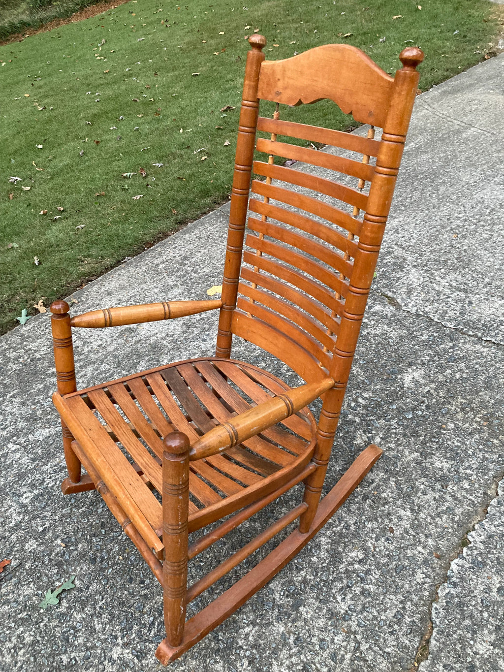 Early 20th Century Rare Form Oak Rocking Chair With Floating Slat Back and Seat