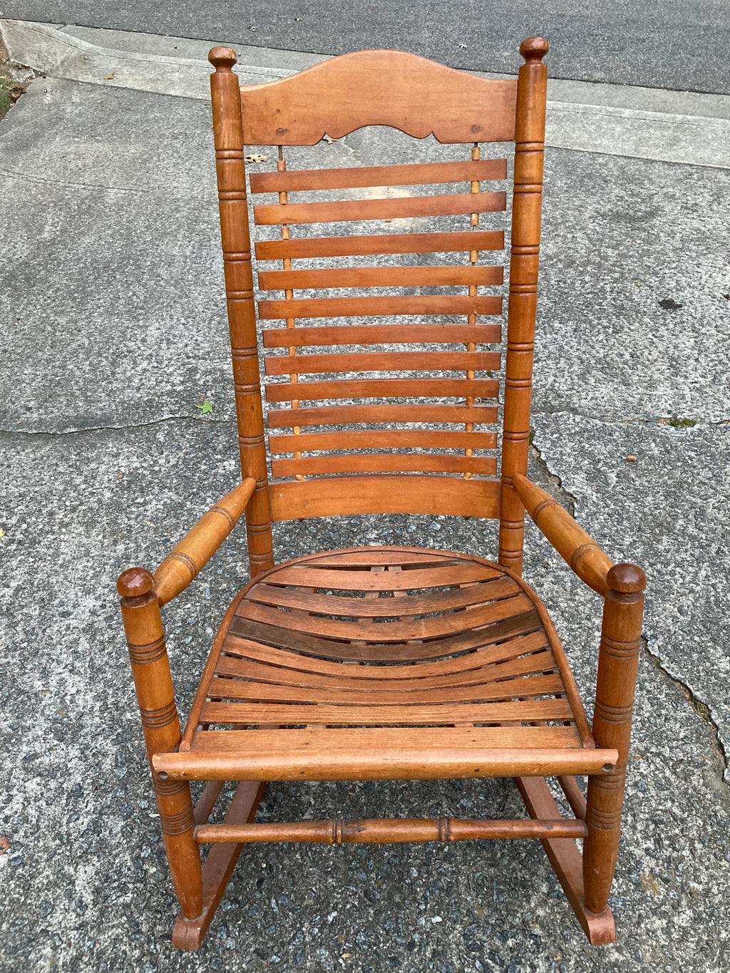Early 20th Century Rare Form Oak Rocking Chair With Floating Slat Back and Seat