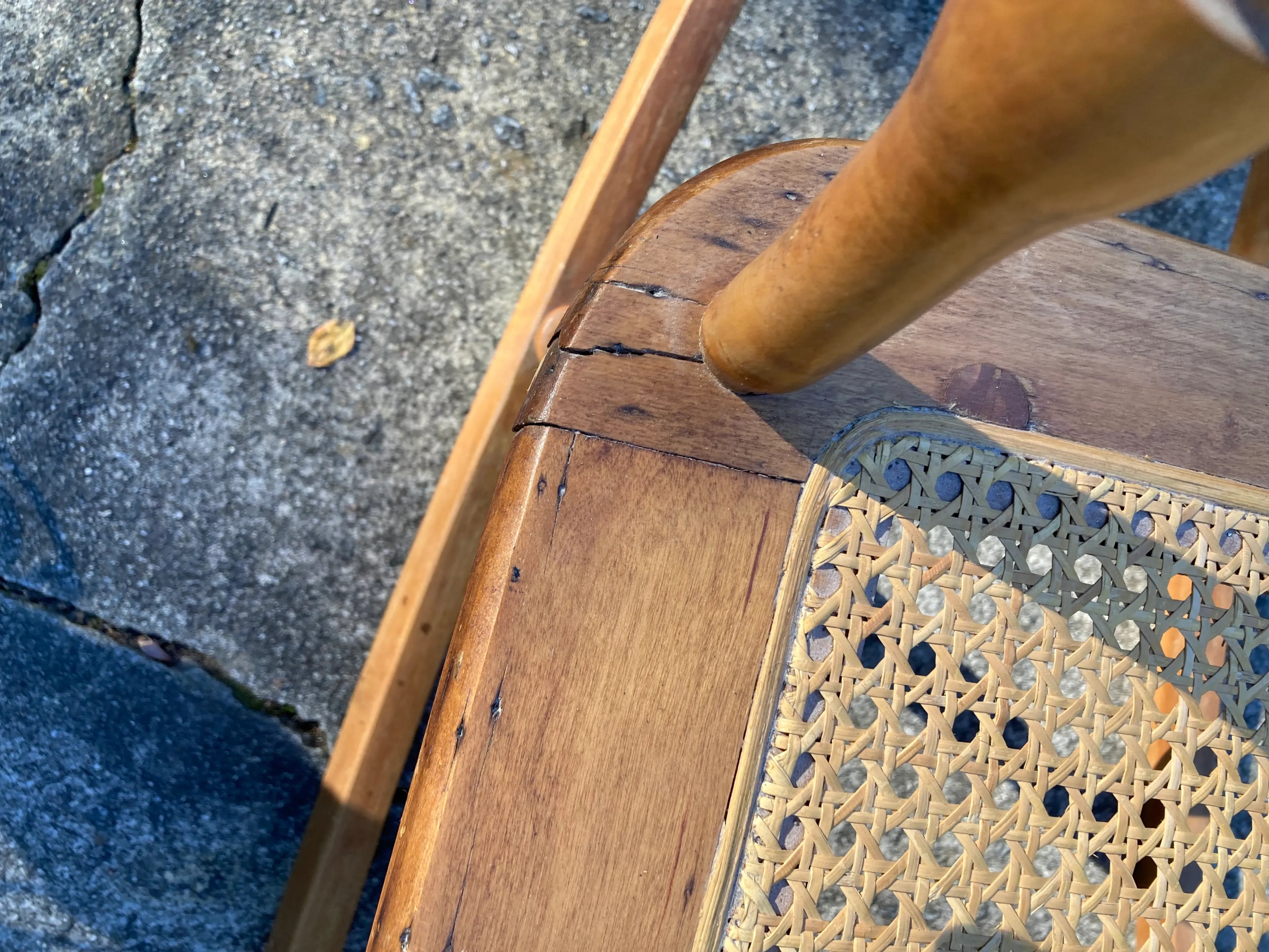 Late 19th Century Antique Turned Wood Ladder Back Open Arm Rocking Chair With Caned Seat