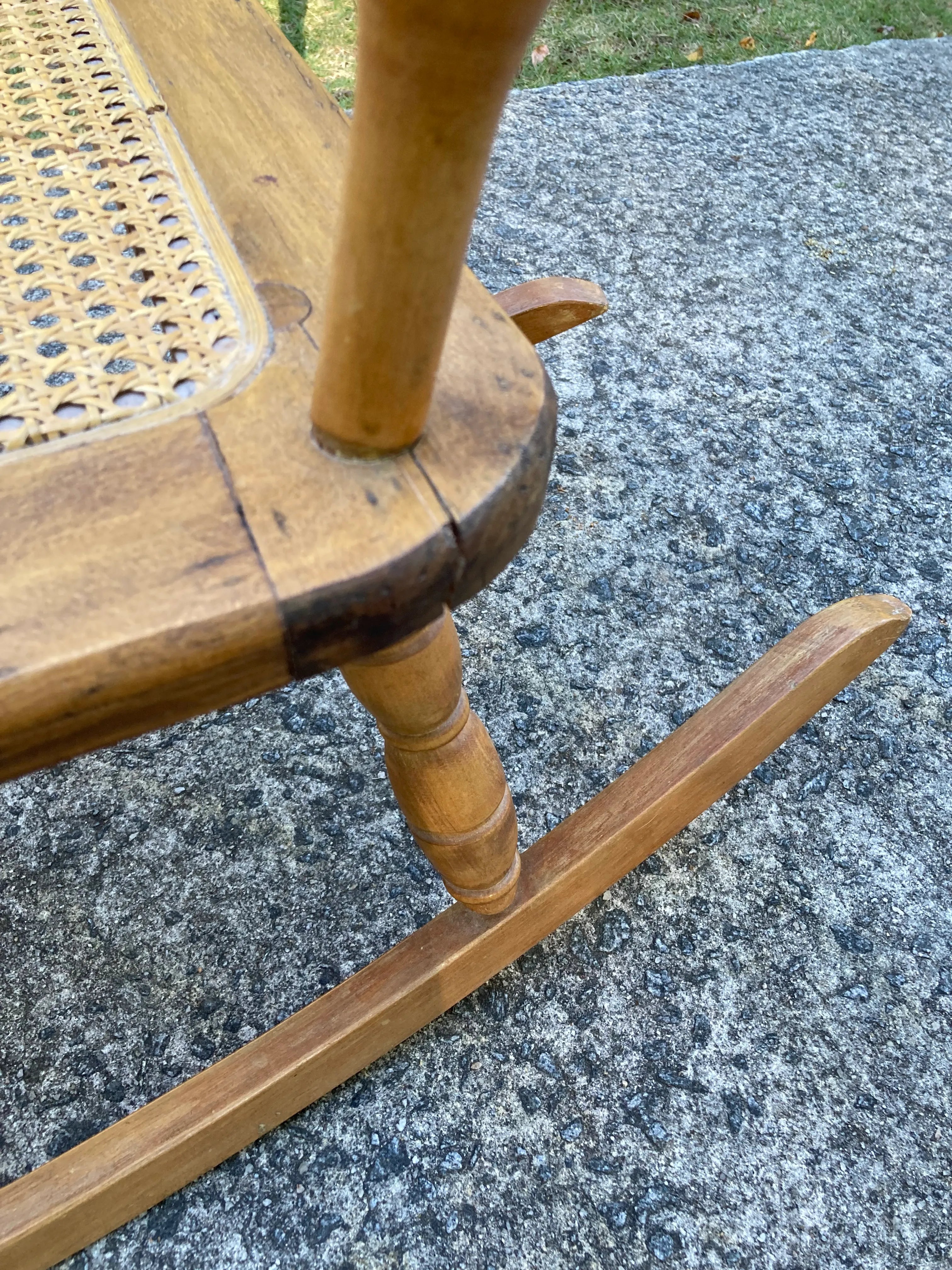 Late 19th Century Antique Turned Wood Ladder Back Open Arm Rocking Chair With Caned Seat