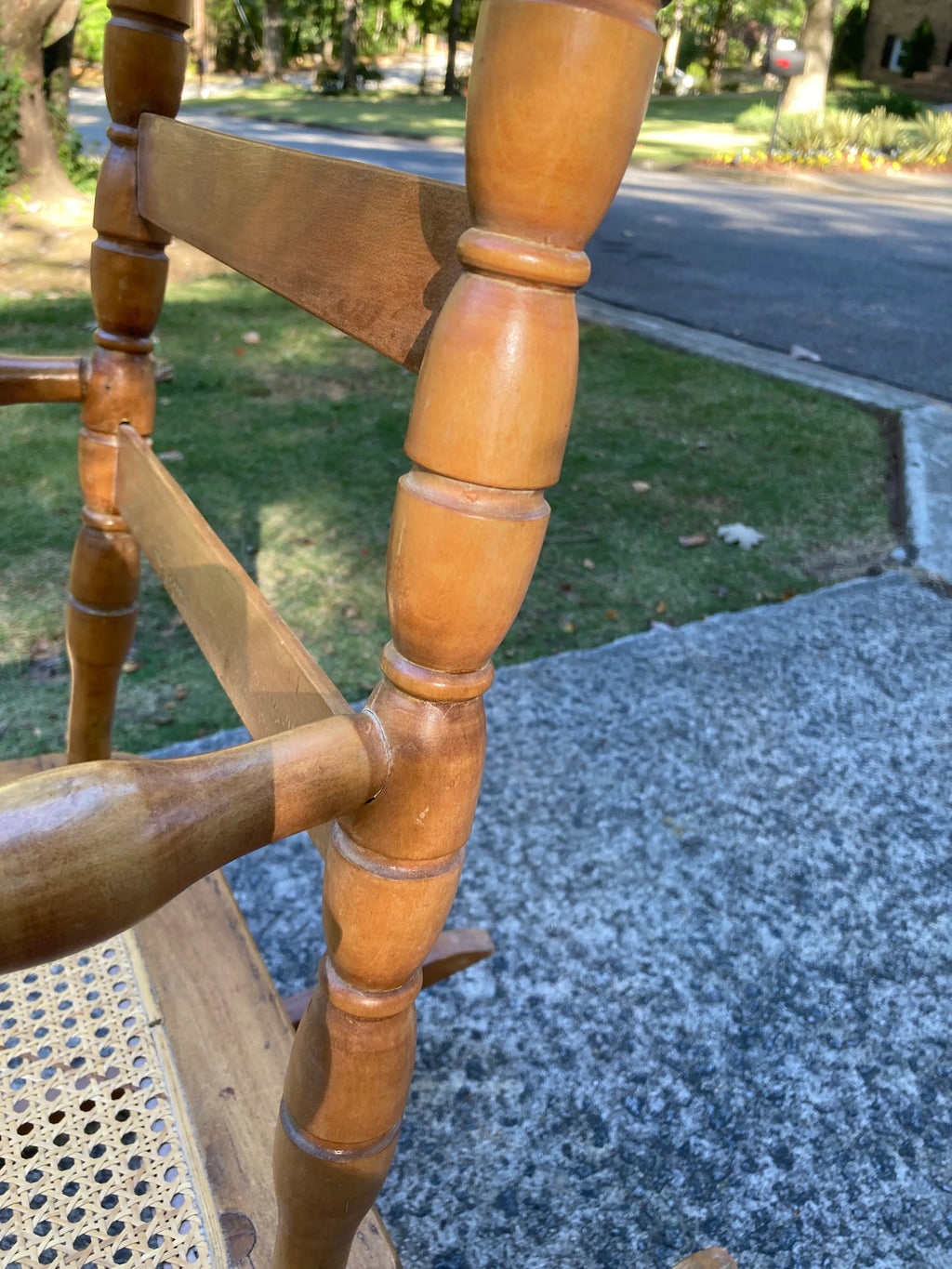 Late 19th Century Antique Turned Wood Ladder Back Open Arm Rocking Chair With Caned Seat