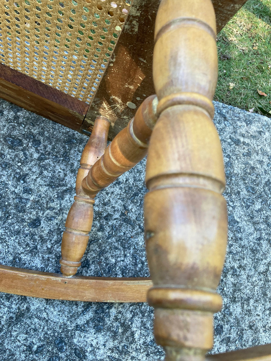 Late 19th Century Antique Turned Wood Ladder Back Open Arm Rocking Chair With Caned Seat
