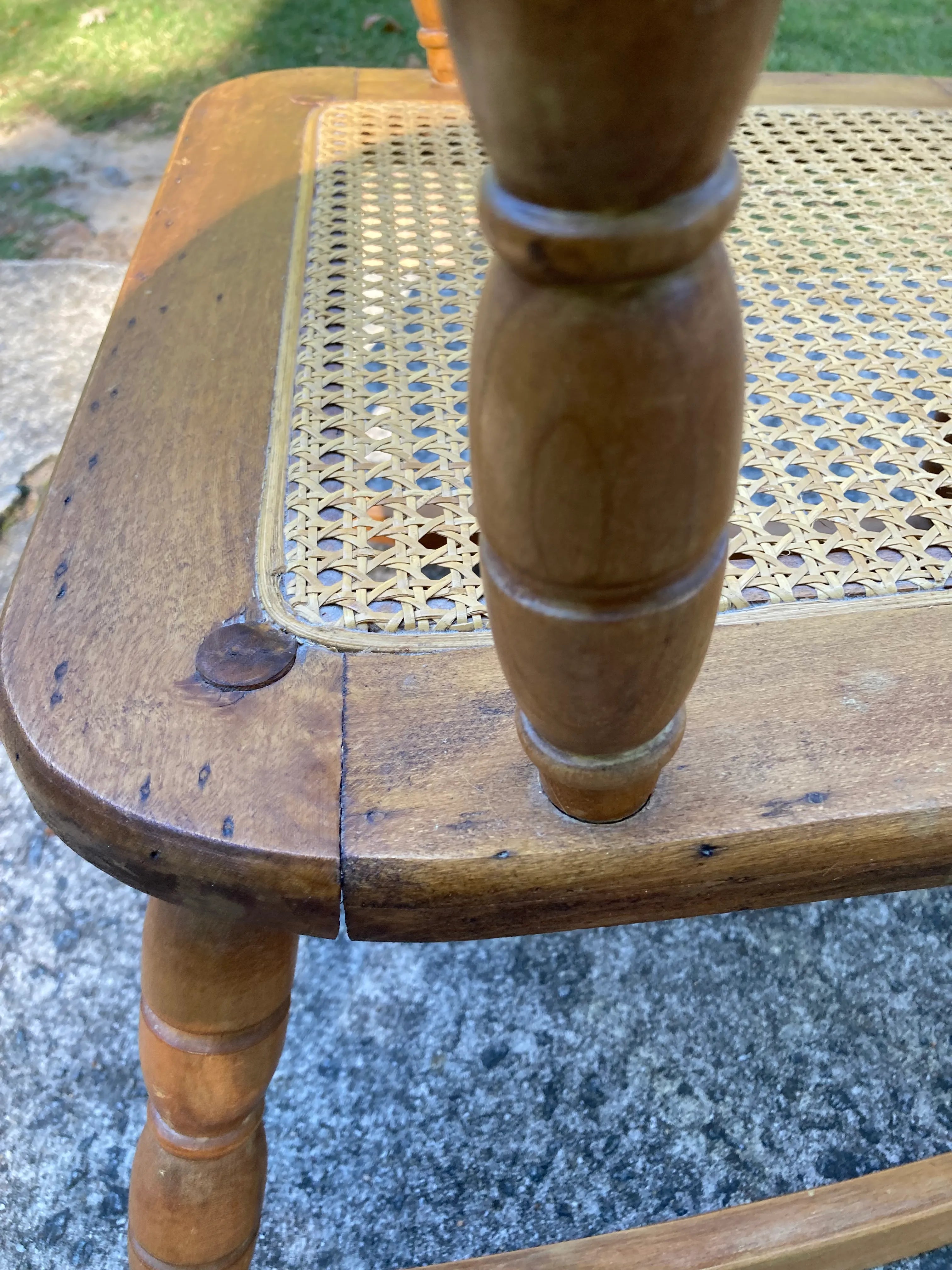Late 19th Century Antique Turned Wood Ladder Back Open Arm Rocking Chair With Caned Seat