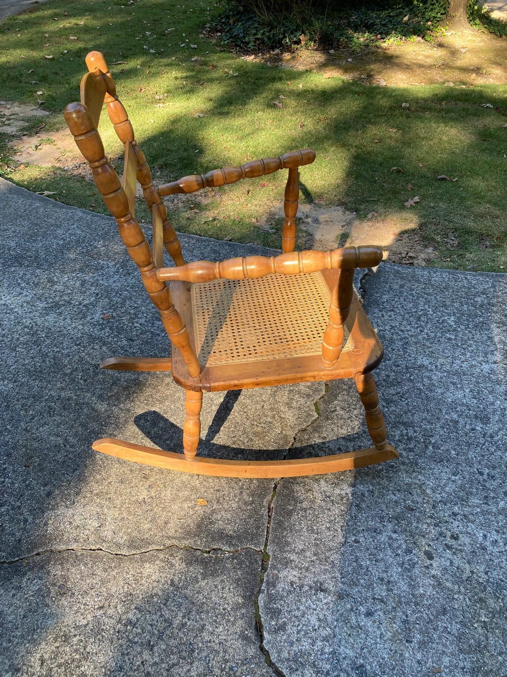 Late 19th Century Antique Turned Wood Ladder Back Open Arm Rocking Chair With Caned Seat