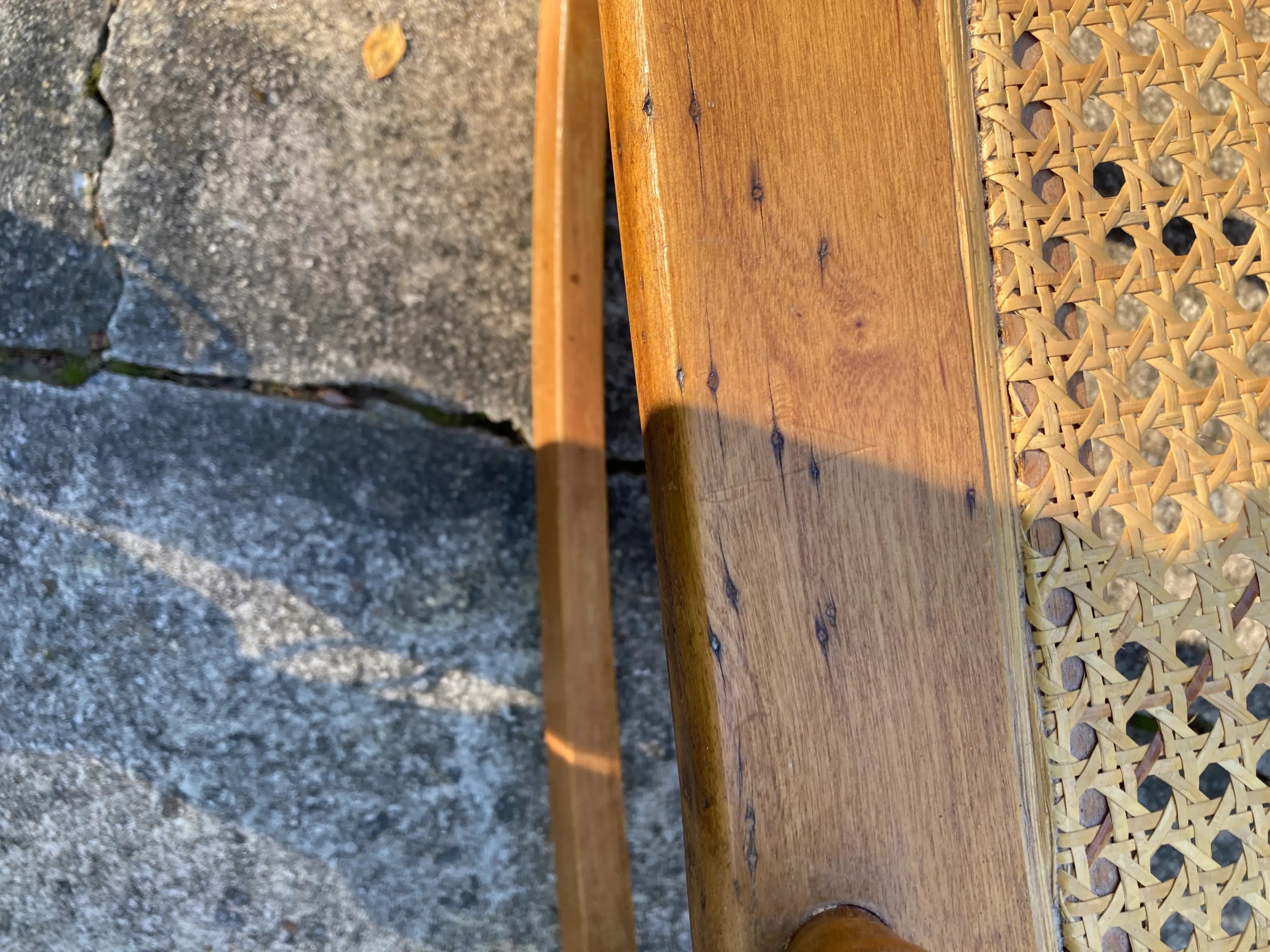 Late 19th Century Antique Turned Wood Ladder Back Open Arm Rocking Chair With Caned Seat